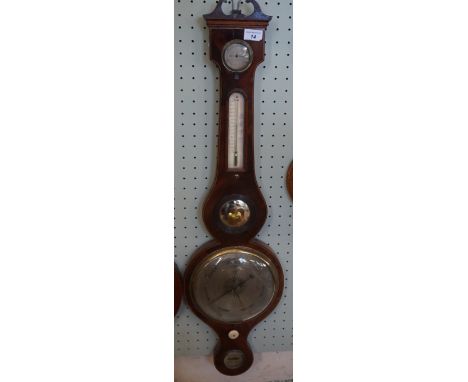 A Masonic mahogany wheel barometer, 19th Century 
The central dial with the dividers and set square, with ivory adjustment kn