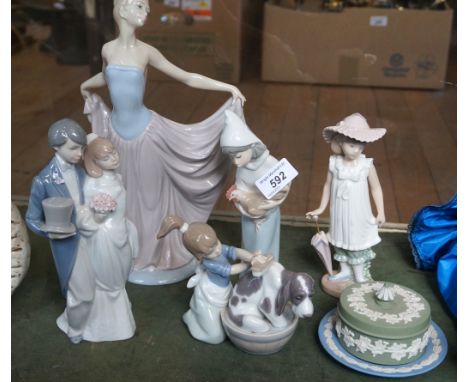 A group of Lladro and Nao figures to include a model of a girl washing dog, a Lladro model of a married couple, a girl holdin