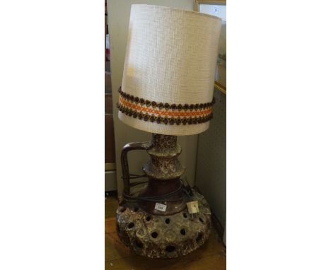 A West German Fat Lava floor lamp with original shade
Having pierced and black lava decoration on a brown glazed body, height
