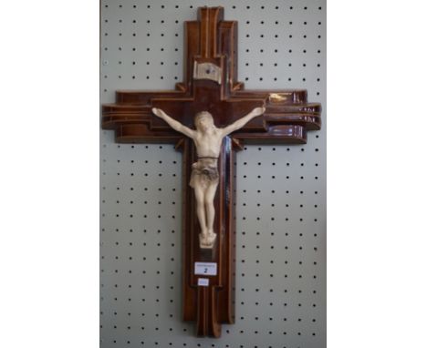 An early 20th Century brown glazed ceramic model depicting Christ on the cross.