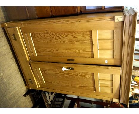 A Vintage pine twin door armoire, the twin panelled doors having single base drawer.