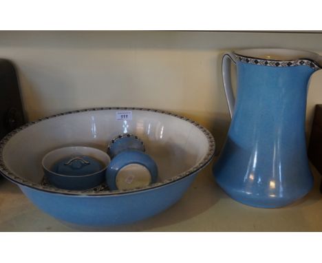 A late 19th/early 20th Century ceramic four piece bathroom set, comprising jug and bowl, toothbrush holder, soap holder. 