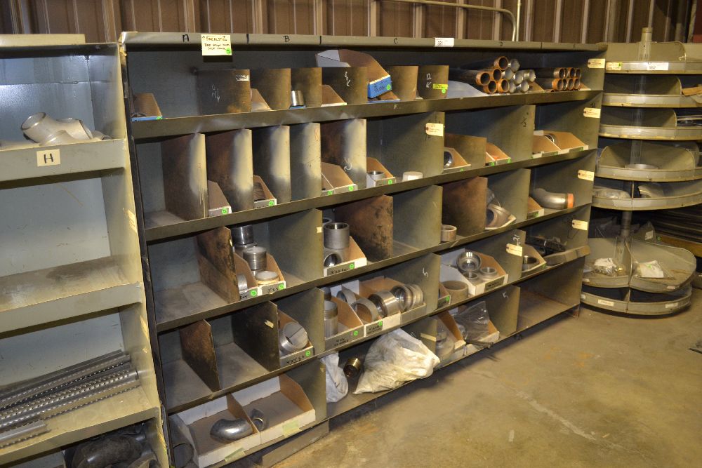 metal storage bin with assortment of pipe fittings, 2" 4"