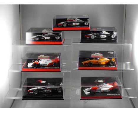 Minichamps - a collection of seven 1:43 scale F1 cars with a McLaren theme, includes Minichamps Team Edition West McLaren Mer