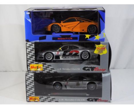 UT Models, Maisto - three 1:18 scale diecast model cars, consisting of two Maisto GT Racing Mercedes CLK LM and one UT Models