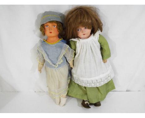 Vintage dolls - a pair of celluloid painted faced dolls one with felt straw stuffed body and the other with sawdust cotton bo