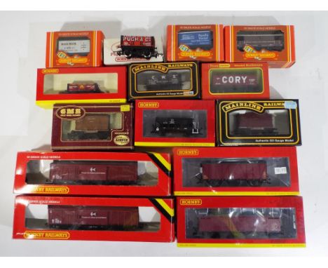 Model Railways - fourteen boxed wagons by Hornby, Mainline and GMR in OO gauge to include R6592 4 Plank Wagon, R6650 BR Trout