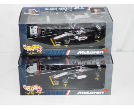 Hot Wheel - a lot of two 1:24 scale F1 diecast cars by Hot Wheels, includes McLaren Mercedes MP4-14 Mika Hakkinen RN1 and McL