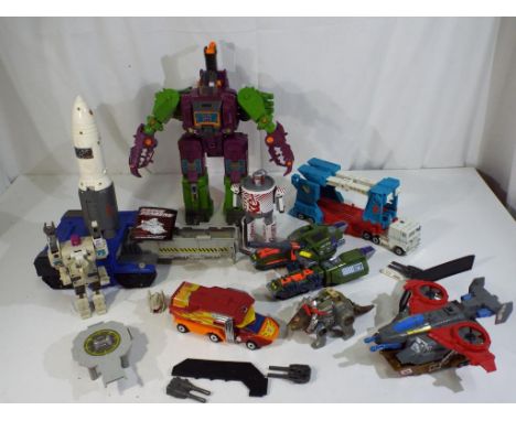 Transformers - a collection of nine vintage Hasbro Transformer vehicles and parts, including Headmaster, Scorponok, Skyhammer