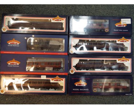Bachmann - eight OO gauge passenger carriages comprising 34-330, 34-603, two off 34-626, 34-650, 39-332, 39-779 and 39-101A, 