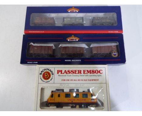 Bachmann - two OO gauge three-wagon sets, SR weathered vans # 38-071Z and Northern weathered wagons # 37-095 (total of six wa