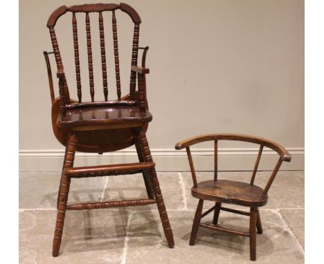 A primitive elm and ash child's chair, 19th century, with a stick back, shaped and figured elm seat upon tapering cylindrical