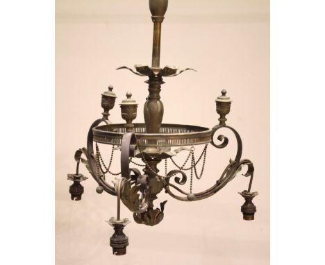 A brass three branch ceiling light fitting, early 20th century, the central baluster column with petal collars over the three