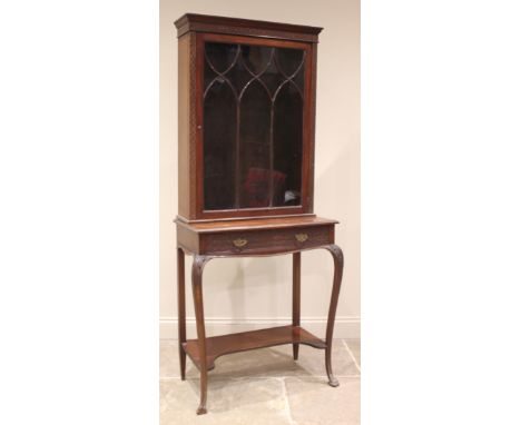 An Edwardian mahogany Chinese Chippendale revival mahogany display cabinet, the moulded cornice over a blind fretwork frieze 