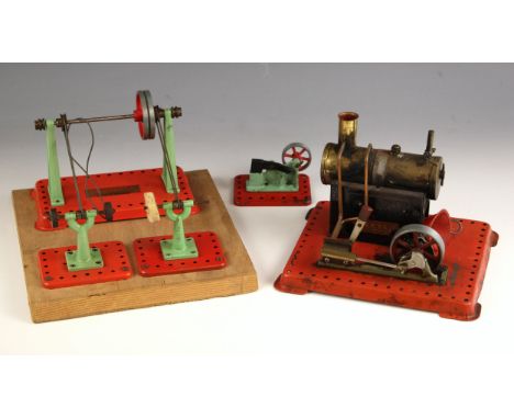 A Mamod live steam engine, the base 20cm wide, with a Mamod grinding wheel and buffer later mounted on a wooden base, the bas
