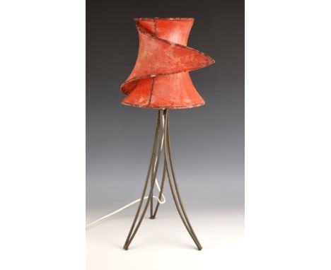A mid 20th century vellum table lamp, the 'wrap-around' shade upon three iron hairpin type supports, 70cm high (including sha