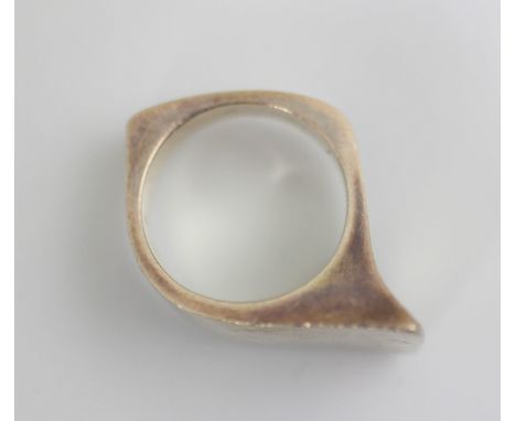A Georg Jensen dress ring, designed by Bent Gabrielsen, of asymmetrical form, stamped ‘Georg Jensen 175 GB’ ring size K, 17gm