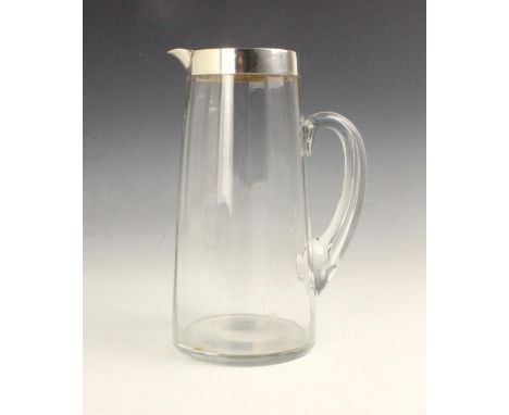 A George VI silver mounted pitcher, ‘J&amp;S’ Birmingham 1945, the plain polished mount upon the tapered faceted glass body, 