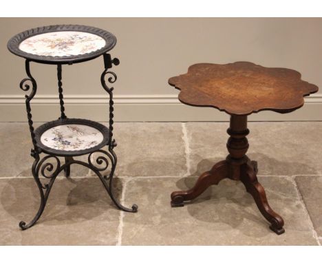 A 19th century oak tripod table, the scalloped circular top upon a baluster column and three shaped down swept supports with 