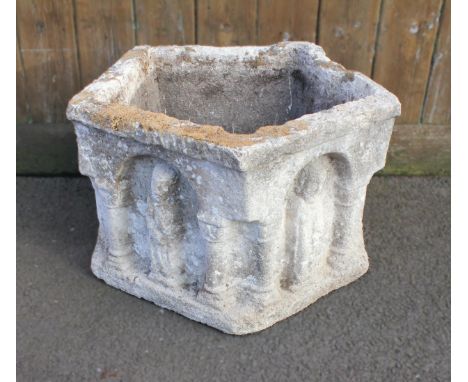 ERNEST SHACKLETON INTEREST; a carved stone pentagonal font or planter, each of the arcaded sides centred with a relief carved