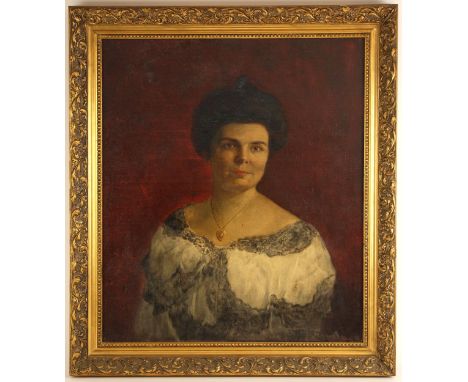 Hispanic School (late 19th century),Portrait of a lady wearing a heart-shaped locket,Oil on canvas,Indistinctly signed lower 