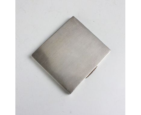 A George VI silver gilt cigarette case, W H Manton Ltd, Birmingham 1941, the rectangular case with engine turned detail and h