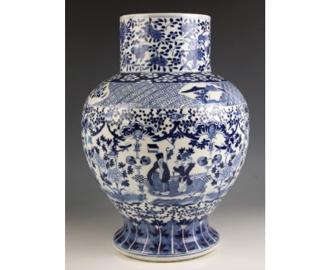 A large Chinese porcelain blue and white baluster vase, 19th century, the baluster shaped temple jar decorated with a continu