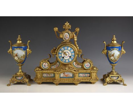 A French Japy Freres gilt metal and bleu celeste porcelain clock garniture, late 19th century, the scrolling acanthus case su