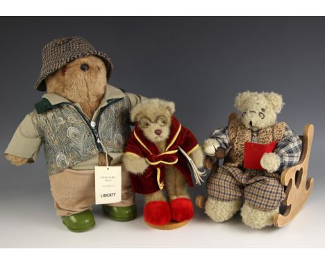 A modern Liberty Of London collectable teddy bear, dressed in a tweed hat Liberty fabric gilet, cords and wellies, with origi