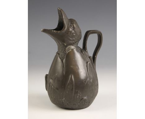 An Art Nouveau pewter jug, modelled as a chick hatching from an egg, the spout as its beak, stamped 'Etainicaranti PUR' to ba