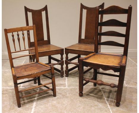 A pair of 18th century oak hall chairs, each with a splat back over a board seat upon baluster and block turned front legs, p