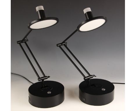 A pair of Heals of London table lamps, each with adjustable arm, upon circular base, in a black matt finish, each with wirele