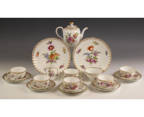 A Dresden porcelain part tea service, late 19th century, comprising: a milk jug, a sugar bowl, a hot water pot and cover, six