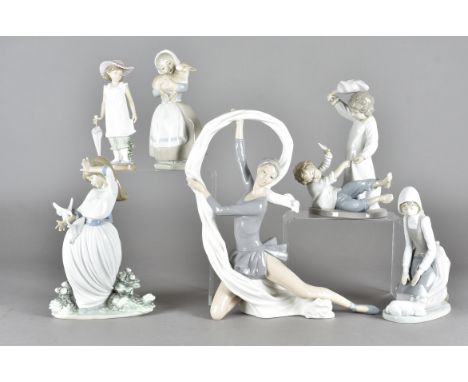 A collection of Nao figures, including a ballerina, a figure of boys having a pillow fight, girl shepherdess and others some 