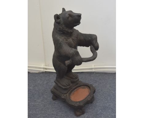 A modern resin bear stick stand, in the Black Forest style 