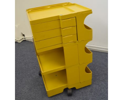 A Joe Columbo boby trolley, in yellow, labelled 'bieffeplast padova Italia' 73 cm high x 43 cm wide x 41 cm deepOverall in go
