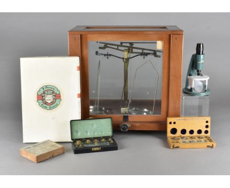 A set of chemical balance scales, together with a quantity of scientific specimen cases, microscope etc 