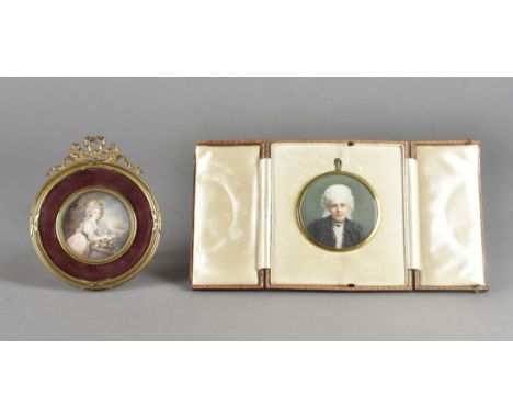 A 19th Century portrait miniature, white haired woman in mourning, with white veil and jet collar in leather triptych easel c