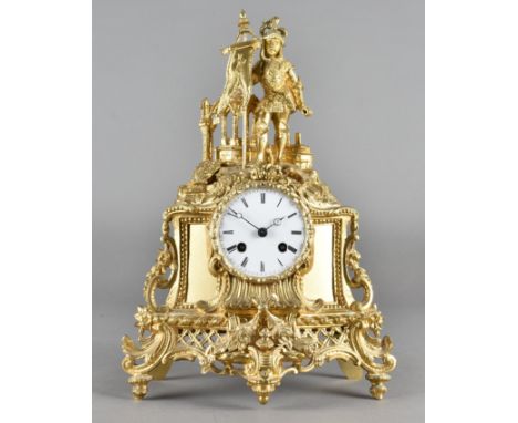 A gilt spelter mantle clock, the white enamel face with black Roman numerals, French drum movement, incised in an ornate brac