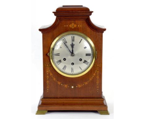 A GERMAN INLAID MAHOGANY MANTLE CLOCK, WITH SILVERED DIAL THE MOVEMENT CHIMING ON ROD GONGS AND MARKED ON BACKPLATE GUSTAV BE