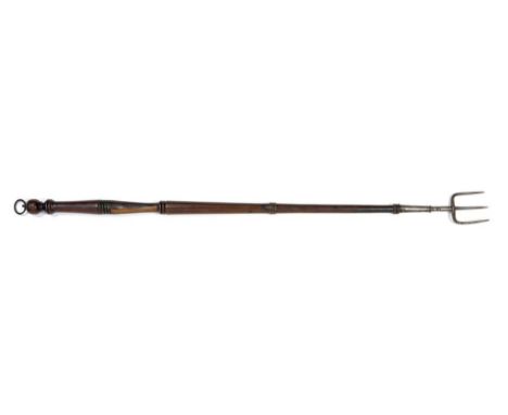 AN EARLY 19TH C STEEL THREE PRONG TOASTING FORK WITH RING TURNED MAHOGANY HANDLE, 68CM L