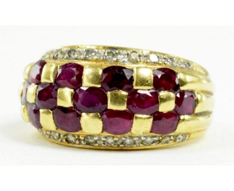 A RUBY CHECKER RING, WITH DIAMOND WINGS IN GOLD, MARKED 750, 7.3G GROSS