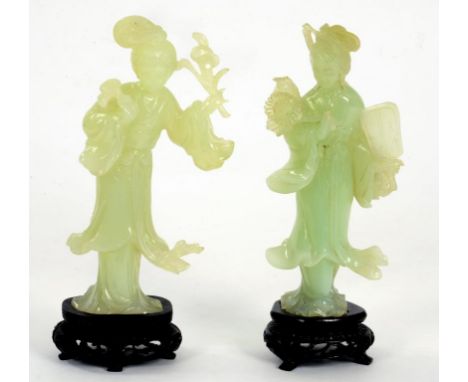 A PAIR OF CHINESE CARVED JADE FIGURES OF YOUNG WOMEN, 17CM H, ON TWO WOOD STANDS, BOXED, 20TH C
