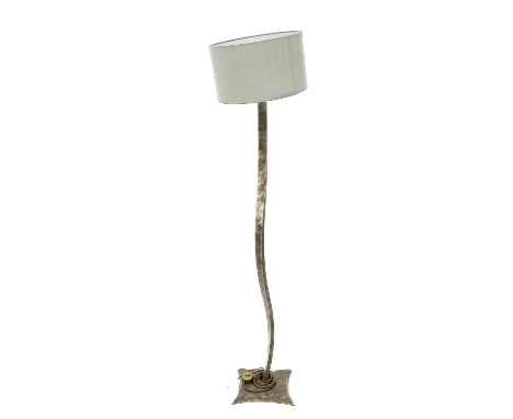 A Porta Romana Italian standard lamp. The carbonised metal shaft of slightly twisted form, height 150cm.