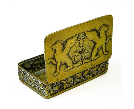 An 18th century brass snuff box with repousse Griffins and foliate frieze panel. Length 9cm.