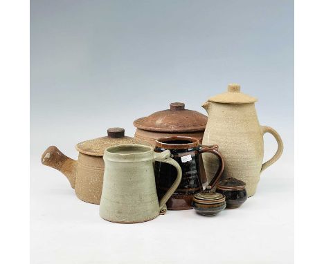 St Ives Leach pottery standard wares. Seven items comprising two lidded casseroles, two mugs, a jug and cover, and two conser