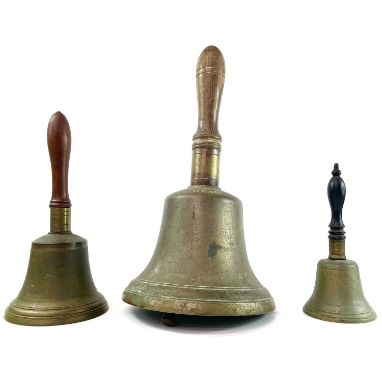A 20th century nine inch brass hand bell by Mears of London. Together with two other hand bells. (3)