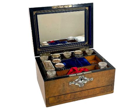A Victorian burr walnut travelling box with mother-of-pearl inlay. With fitted interior compartments, contents of toilet jars