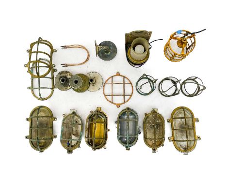 A collection of marine bulkhead light fitting carcasses. Together with two other light fittings.