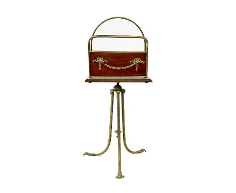 An Edwardian mahogany and brass mounted revolving magazine stand. With brass tripod support, height 82cm width 36cm depth 16c